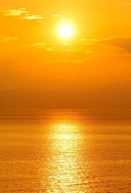 Photo:  Sun setting over the ocean